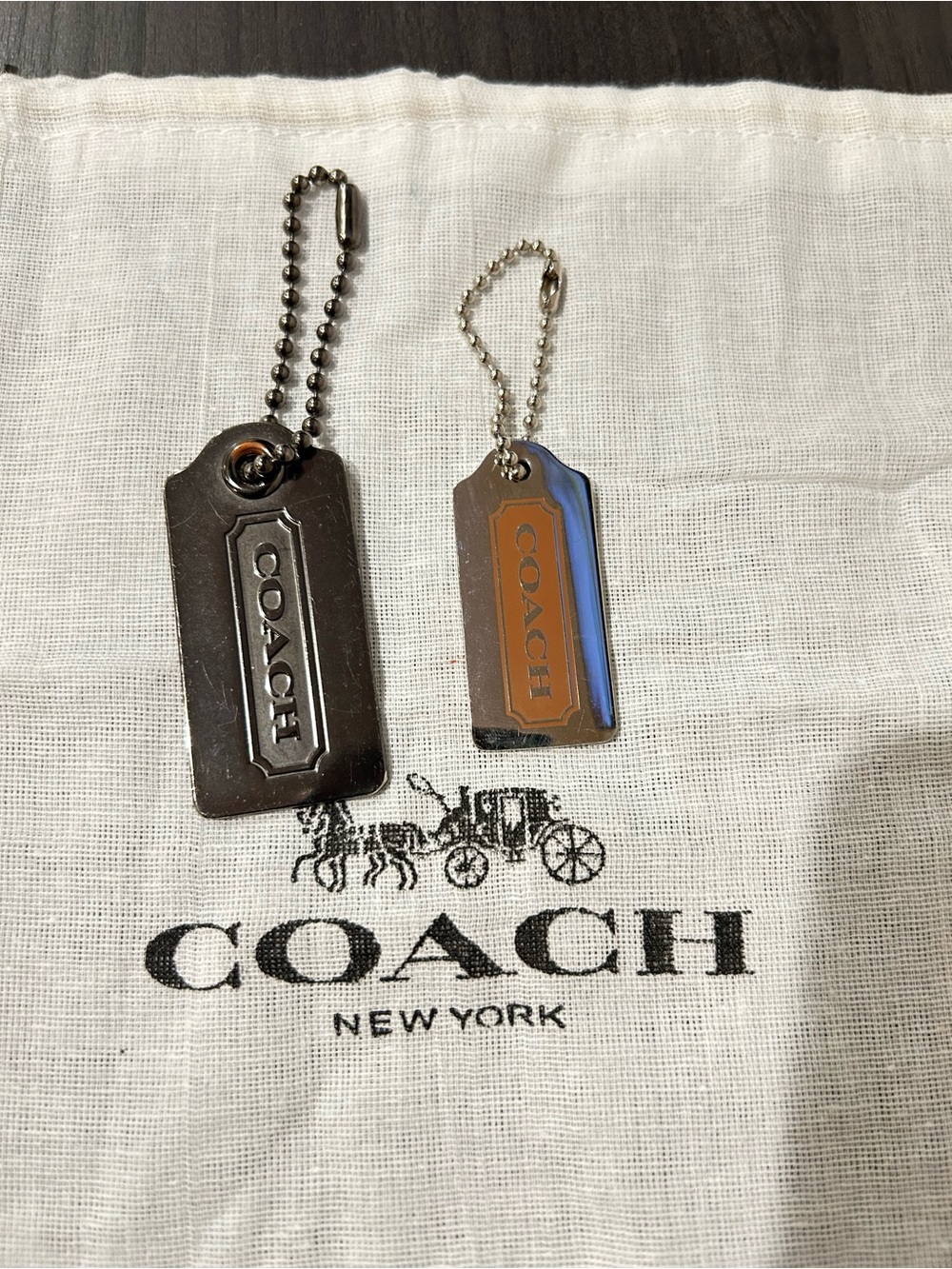 COACH Metal hang tags Keychain Set in Silver & Copper Tones.